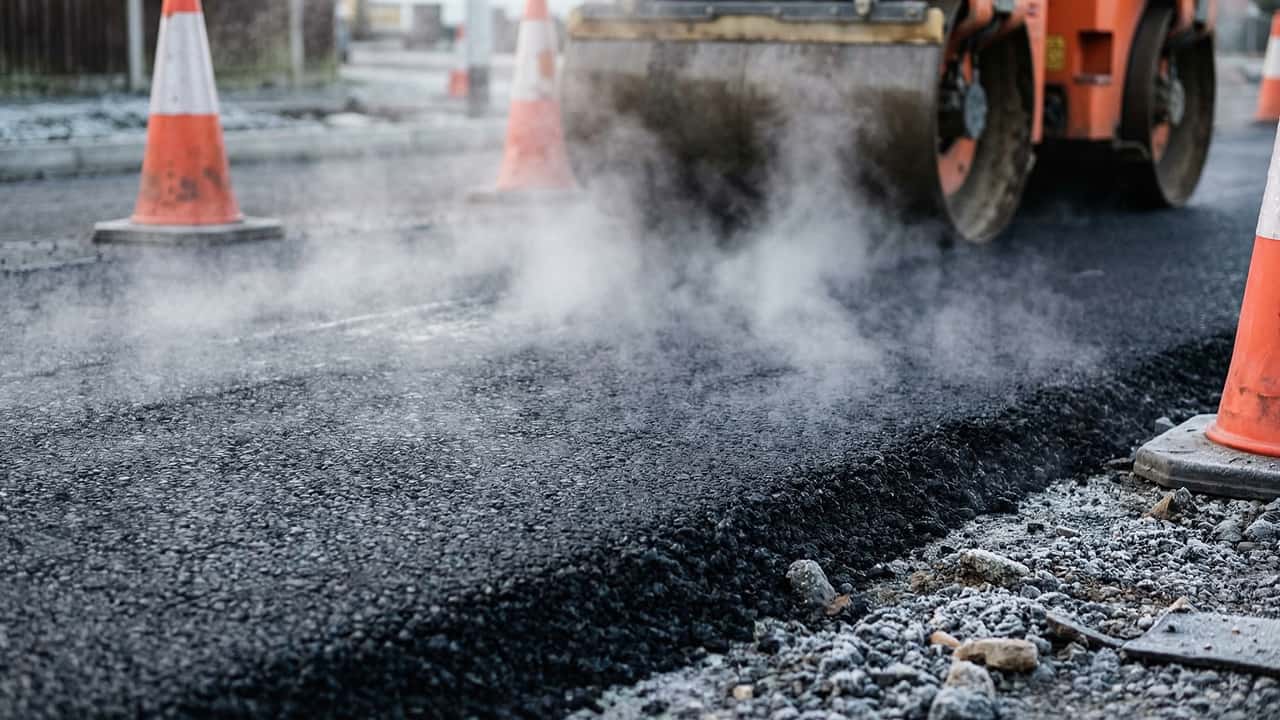 Fresh asphalt paving with a road roller on a Southern California project